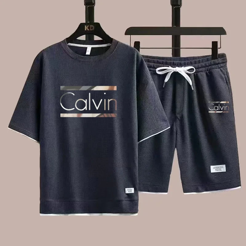 The new European men's casual sportswear two-piece set for the summer of 2025, featuring short sleeves, round necks and sports s - Ellianto fashion Men's
