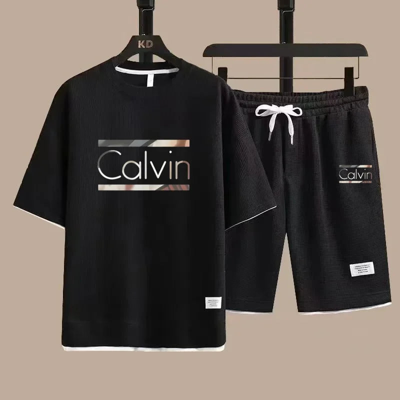 The new European men's casual sportswear two-piece set for the summer of 2025, featuring short sleeves, round necks and sports s - Ellianto fashion Men's