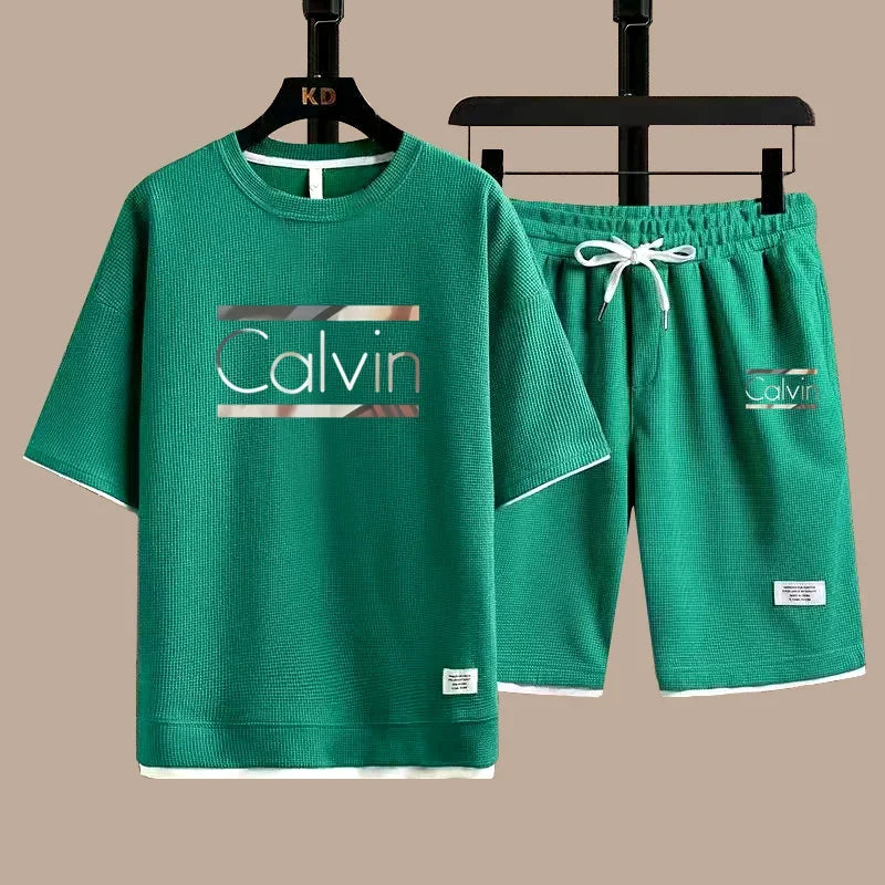 The new European men's casual sportswear two-piece set for the summer of 2025, featuring short sleeves, round necks and sports s - Ellianto fashion Men's