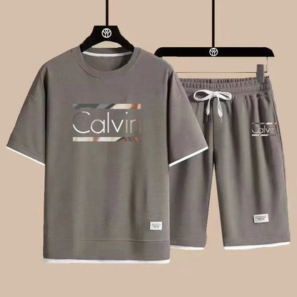 The new European men's casual sportswear two-piece set for the summer of 2025, featuring short sleeves, round necks and sports s - Ellianto fashion Men's