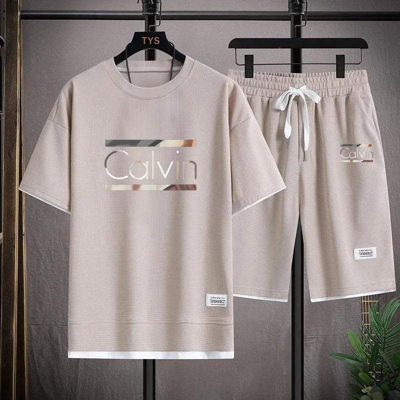 The new European men's casual sportswear two-piece set for the summer of 2025, featuring short sleeves, round necks and sports s - Ellianto fashion Men's